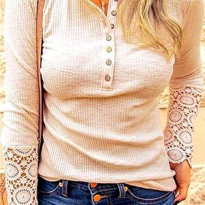 Long sleeve, button top with lace sleeves. Women’s Size medium.